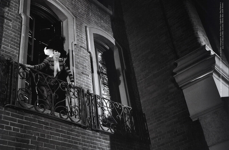woman on a balcony at night