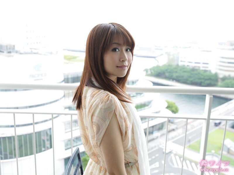 Woman on a balcony overlooking the city