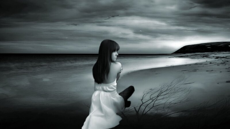 woman on a beach at dusk