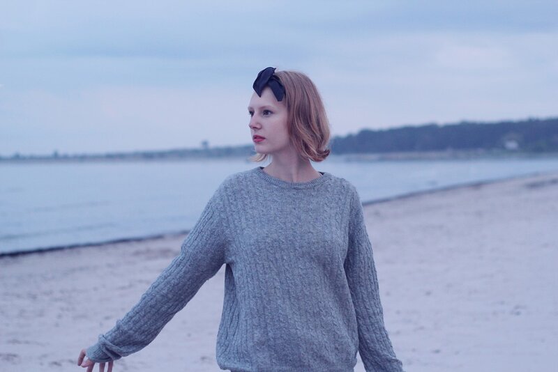 Woman on a beach at dusk