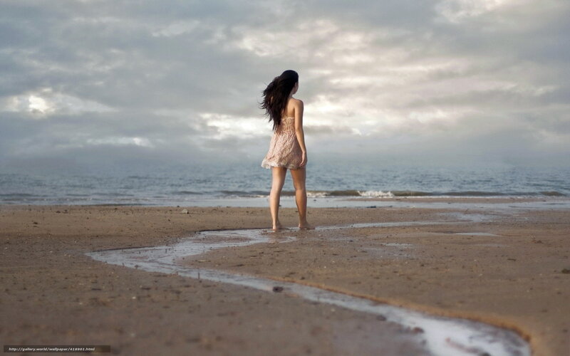 Woman on a beach at dusk
