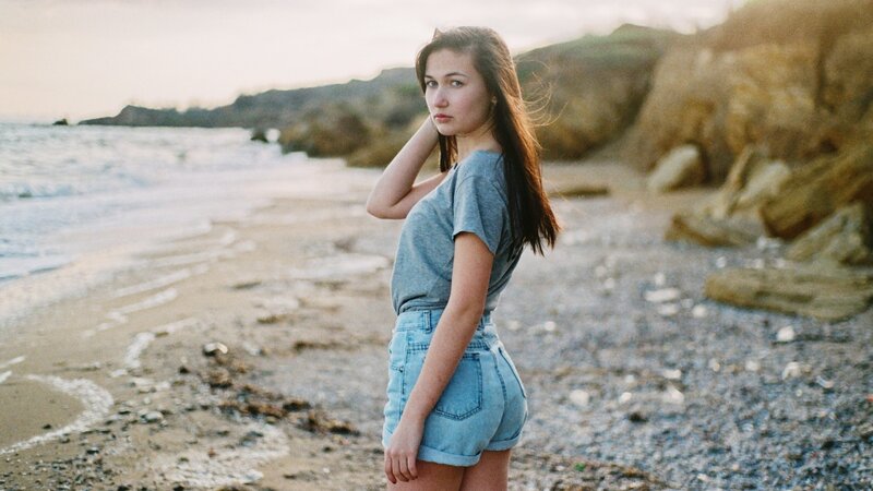 woman on a beach at sunset