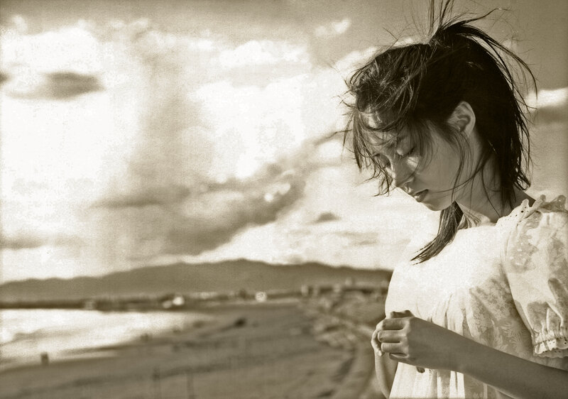 woman on a beach at sunset