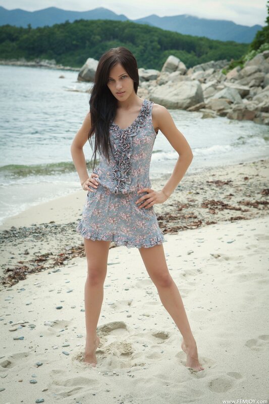 Woman on a beach in floral dress