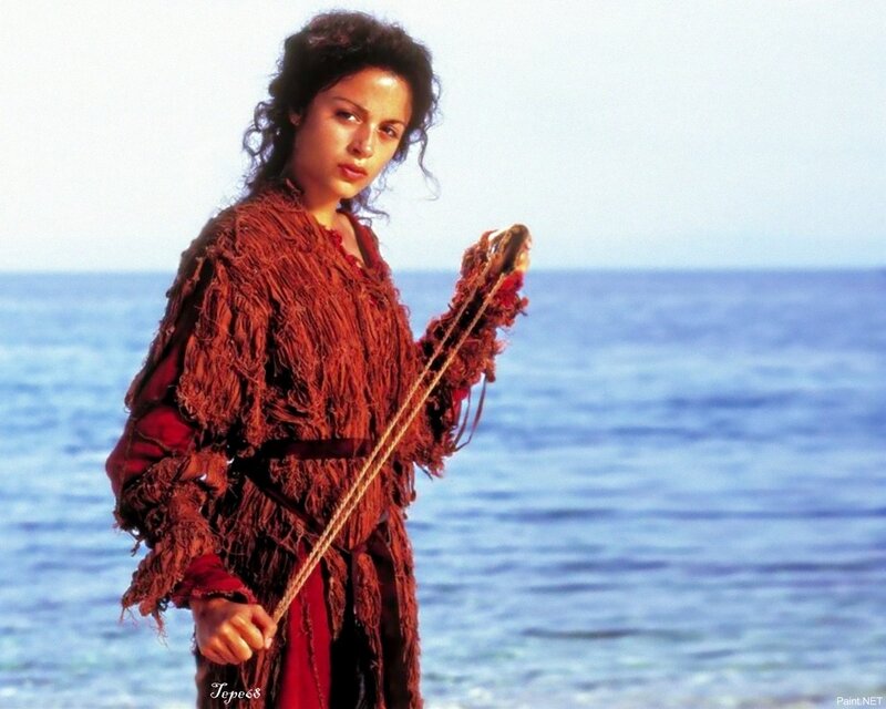 Woman on a beach with rope