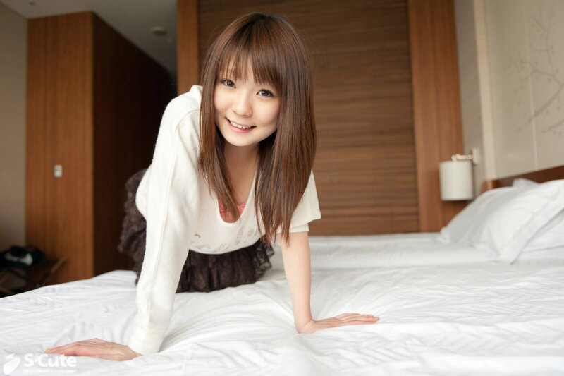 Woman on a bed in a hotel room