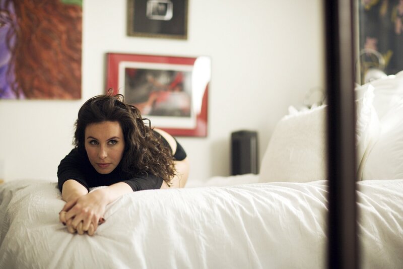 woman on a bed in bedroom
