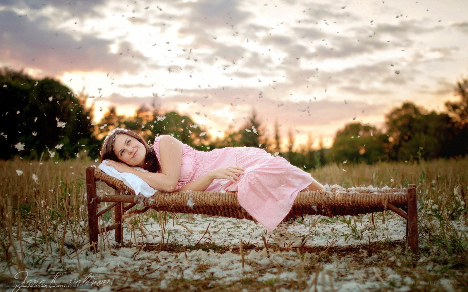 Woman on a bench at sunset