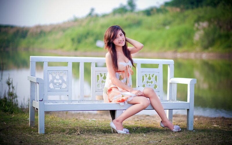 Woman on a bench by the lake