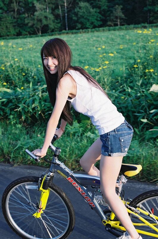 Woman on a bicycle in a field