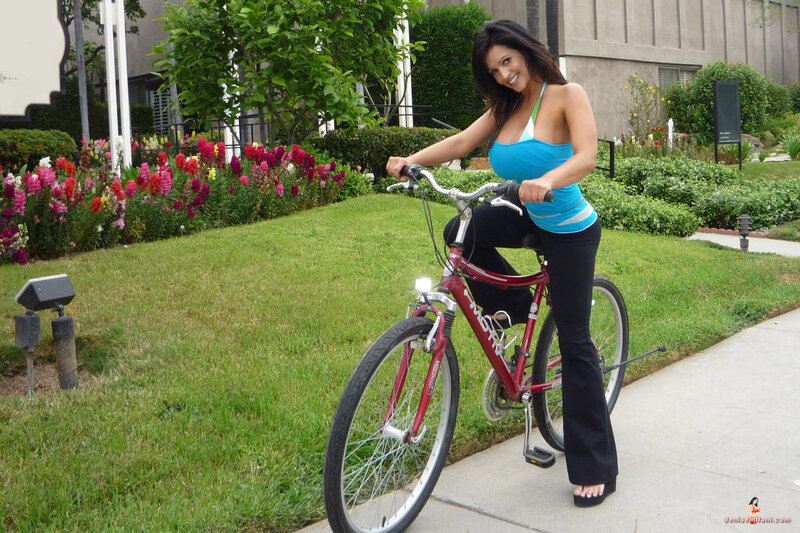 Woman on a bicycle in garden