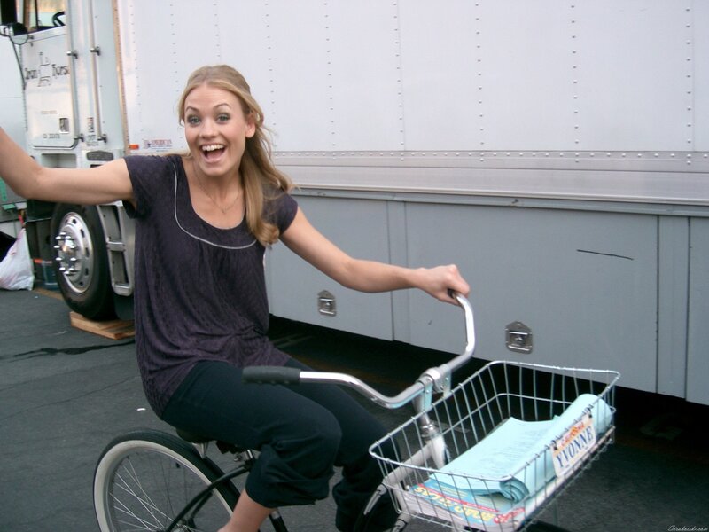 Woman on a bicycle smiling