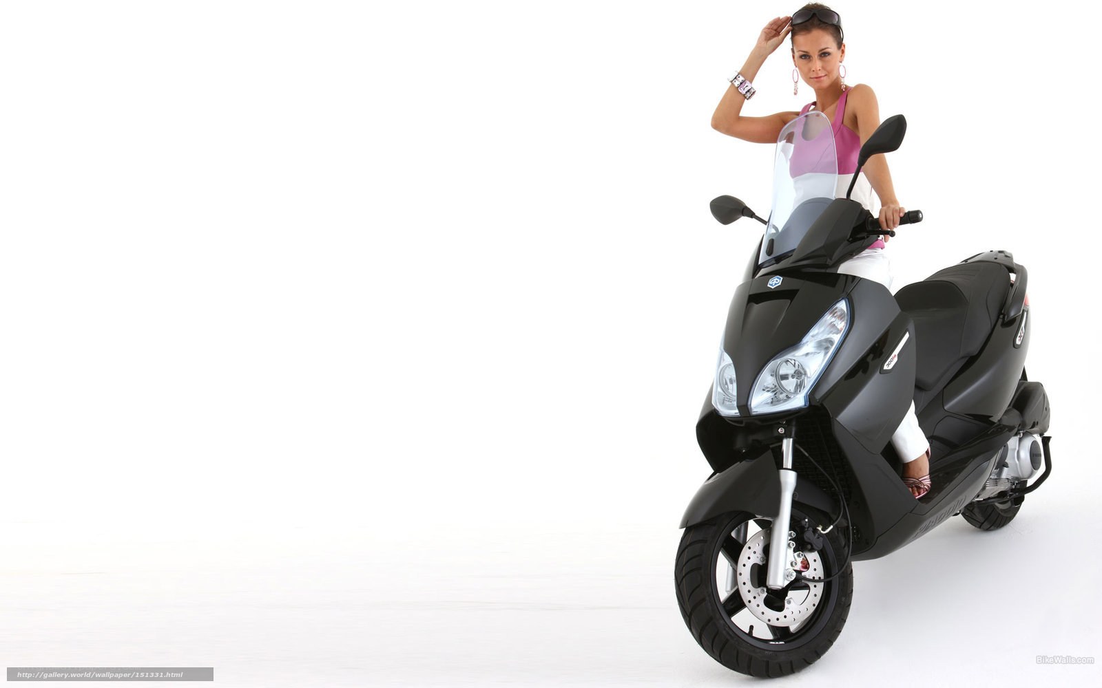Woman on a black scooter