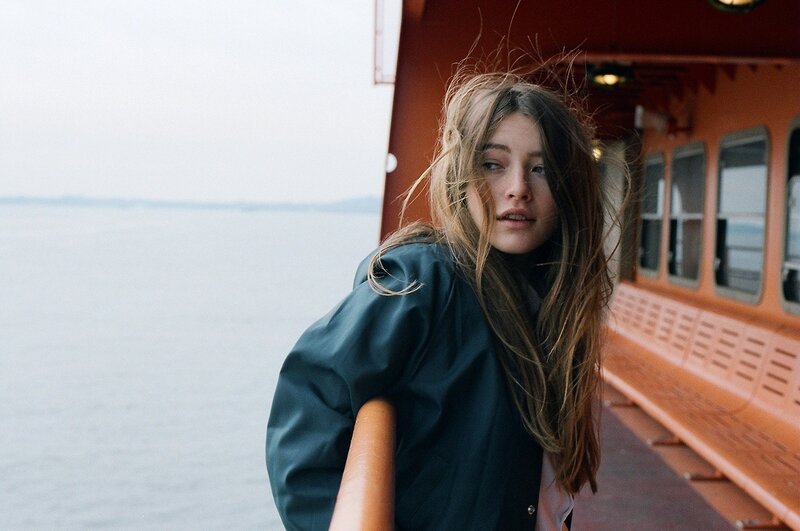 Woman on a Boat — Blue, Calm, Photograph