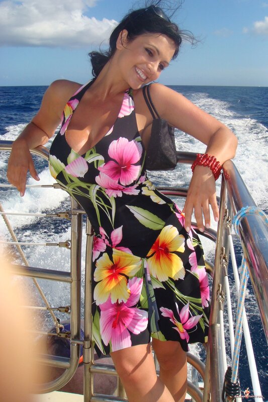 Woman on a boat in floral dress