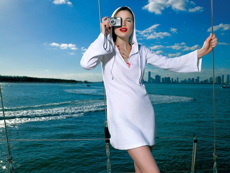 Woman on a boat with camera