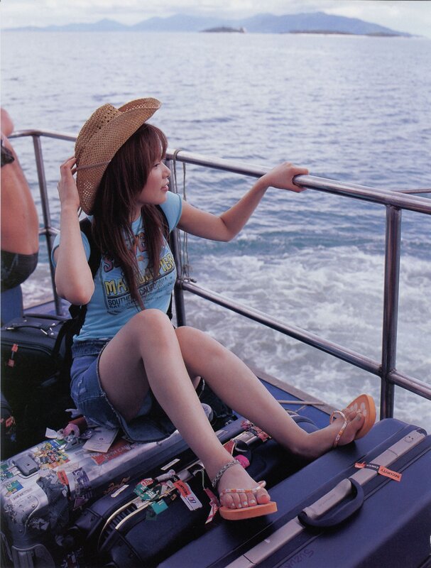 Woman on a boat with luggage