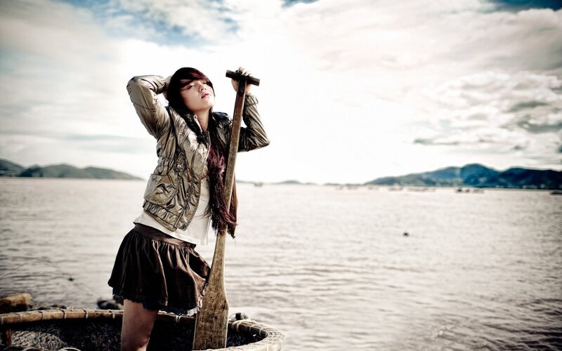 woman on a boat with oar