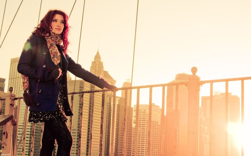 Woman on a bridge at sunset
