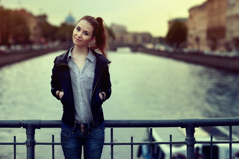 Woman on a bridge by the river
