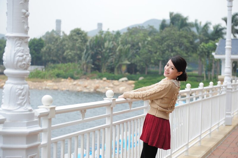 Woman on a bridge by the water