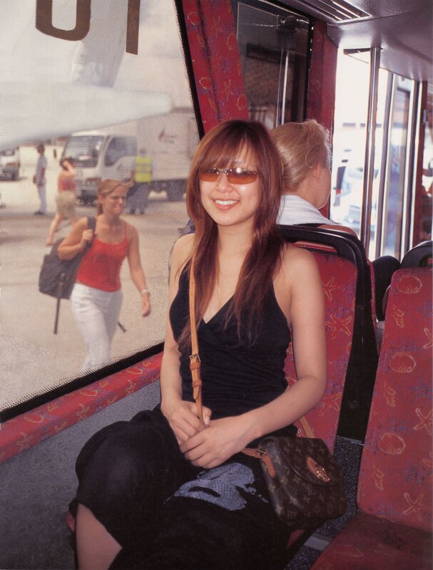 Woman on a bus smiling