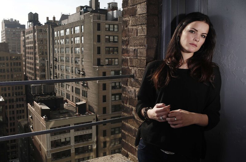 woman on a city balcony