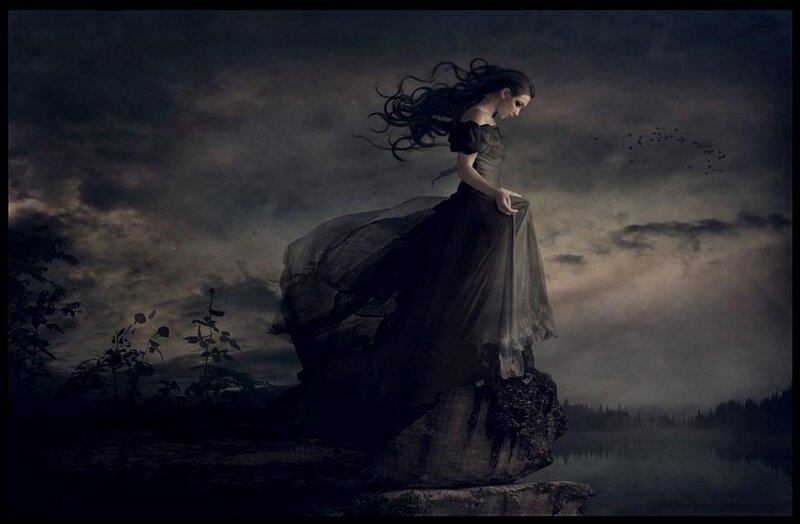 woman on a cliff at dusk
