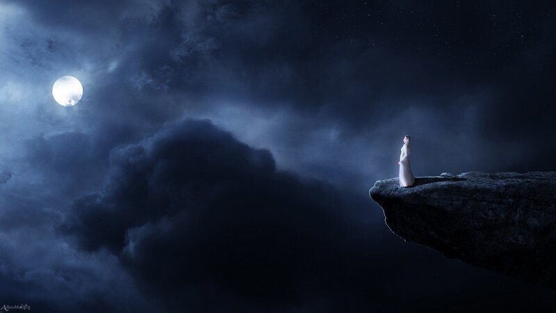 Woman on a cliff at night