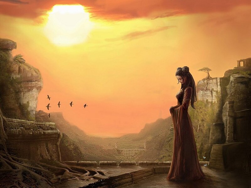 Woman on a cliff at sunset
