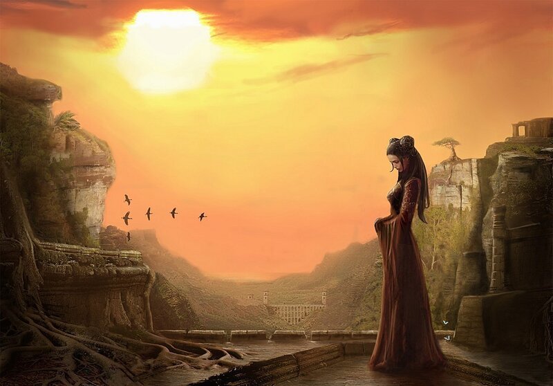 Woman on a cliff at sunset