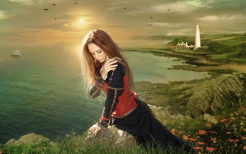 woman on a cliff at sunset