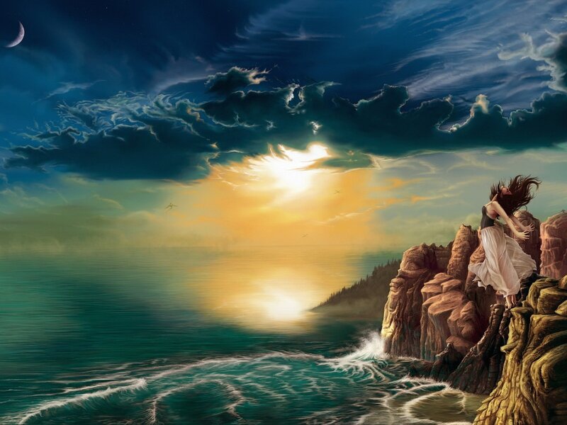 Woman on a cliff at sunset