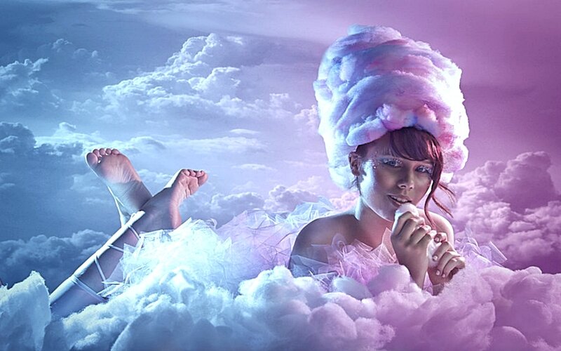 woman on a cloud with cotton candy hair
