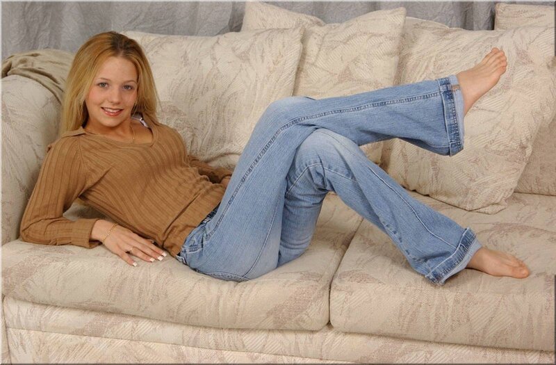 Woman on a Couch — Beige, Relaxed, Photograph, Jeans, Sweater
