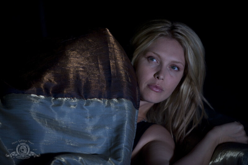 woman on a couch in dim light