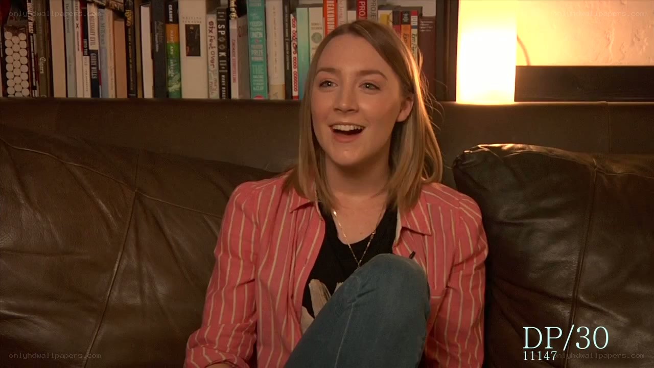 woman on a couch smiling