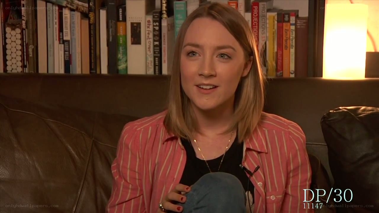 woman on a couch speaking