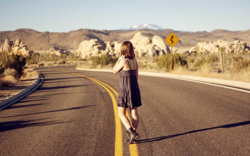 Woman on a desert road