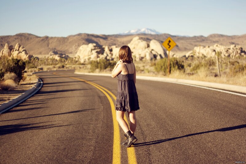 Woman on a desert road
