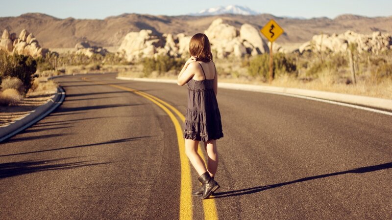 woman on a desert road