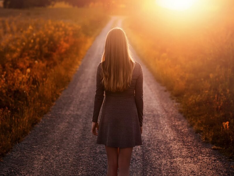 Woman on a Dirt Road — Gold