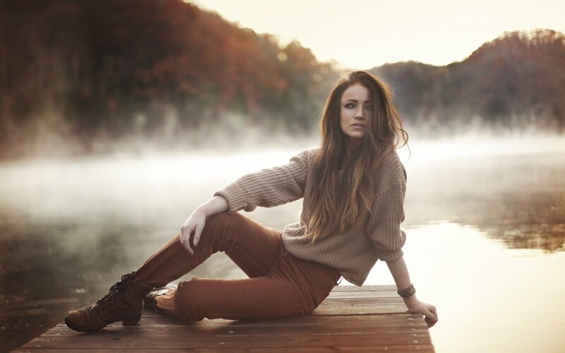 Woman on a dock at dawn