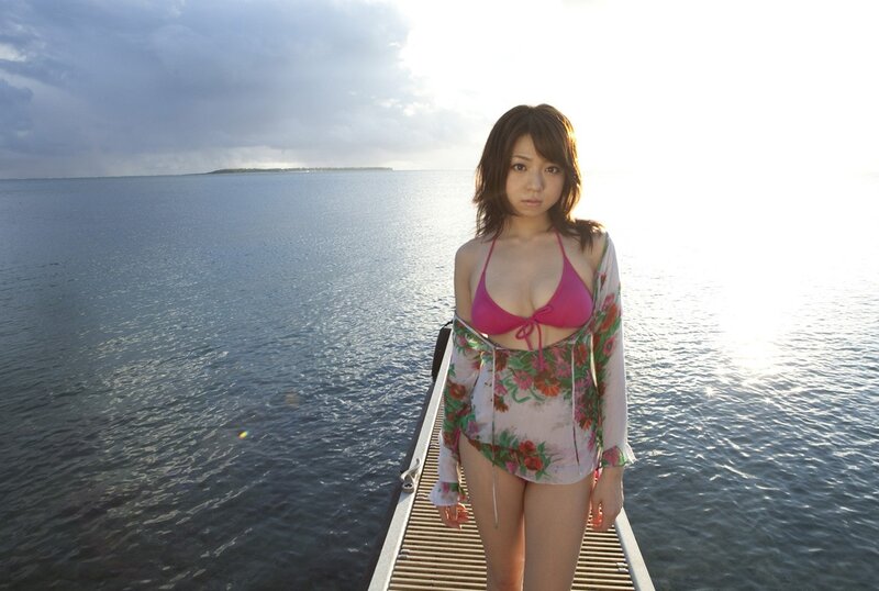 Woman on a dock at sunset