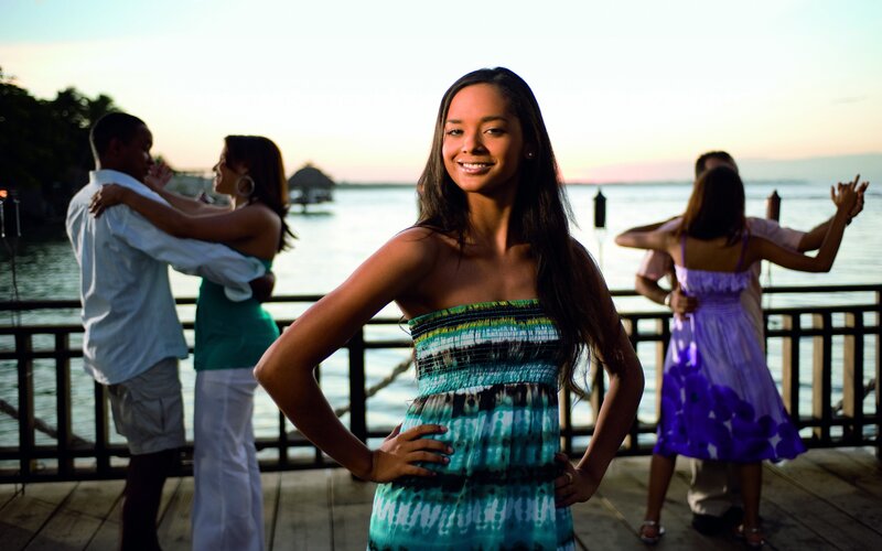 Woman on a dock at sunset