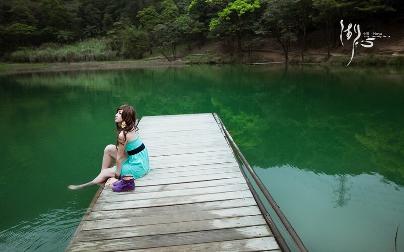Woman on a dock by the lake