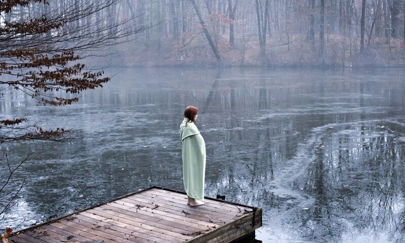Woman on a dock in fog