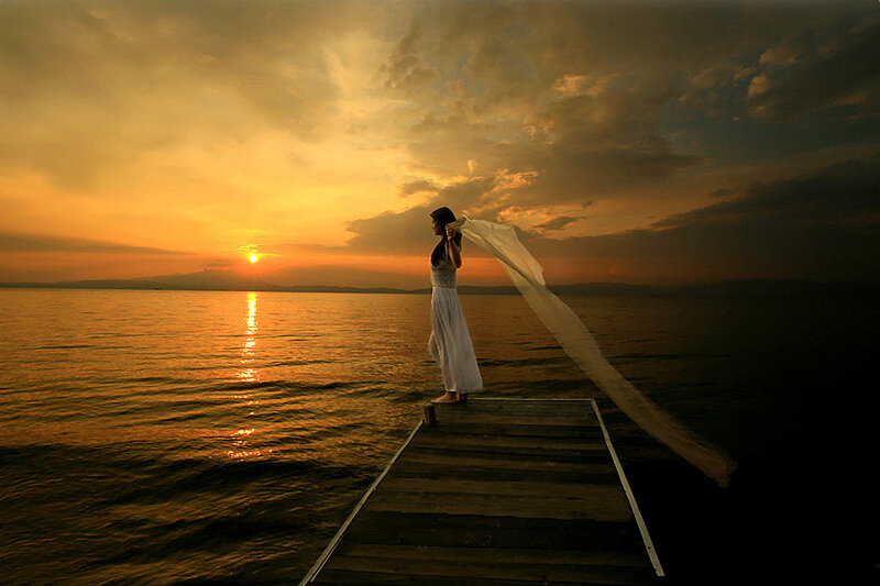 Woman on a Dock — Orange, Serene, Sunset, Photograph, Water