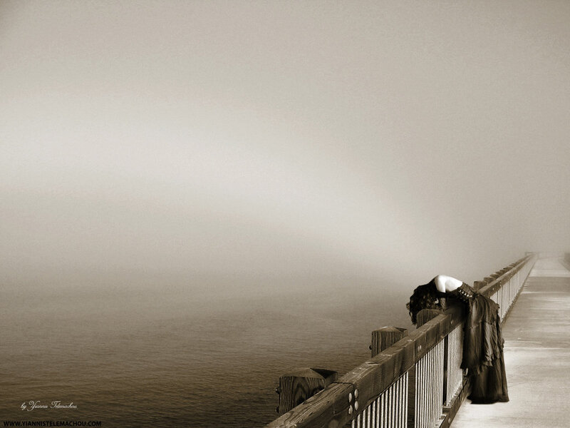woman on a foggy pier