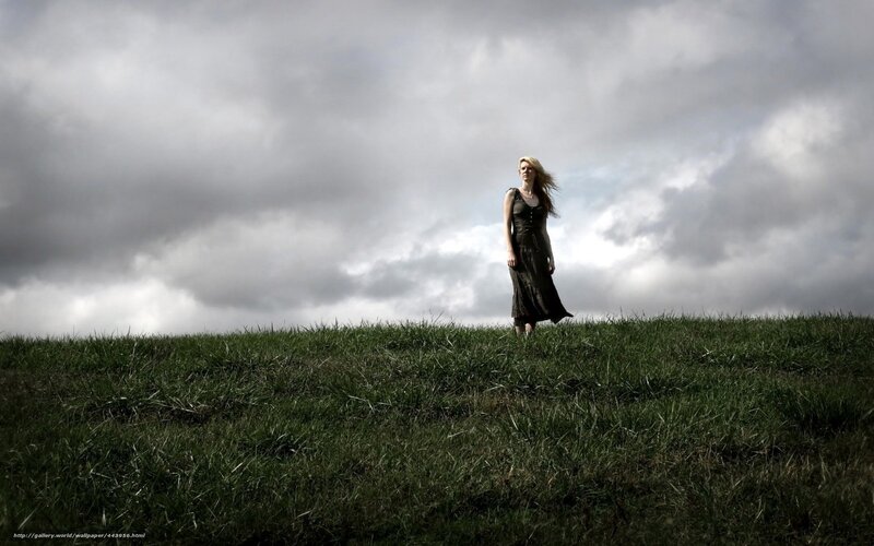Woman on a grassy hill